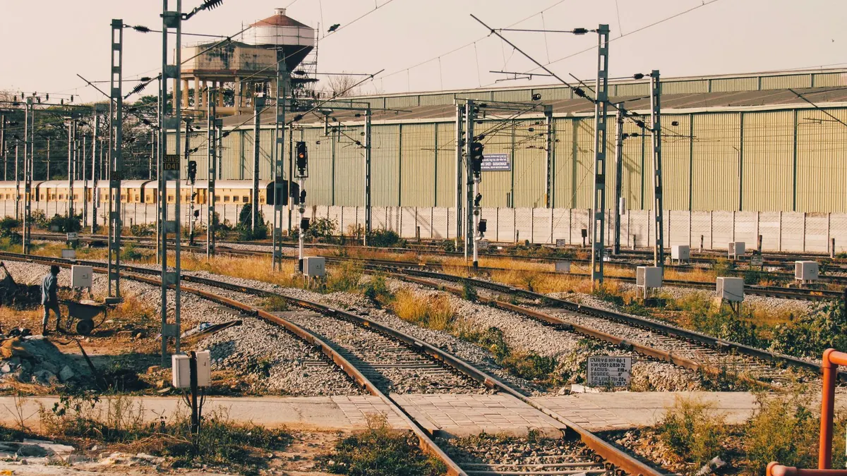 View of railway tracks and infrastructure at a station in Bengaluru, India.