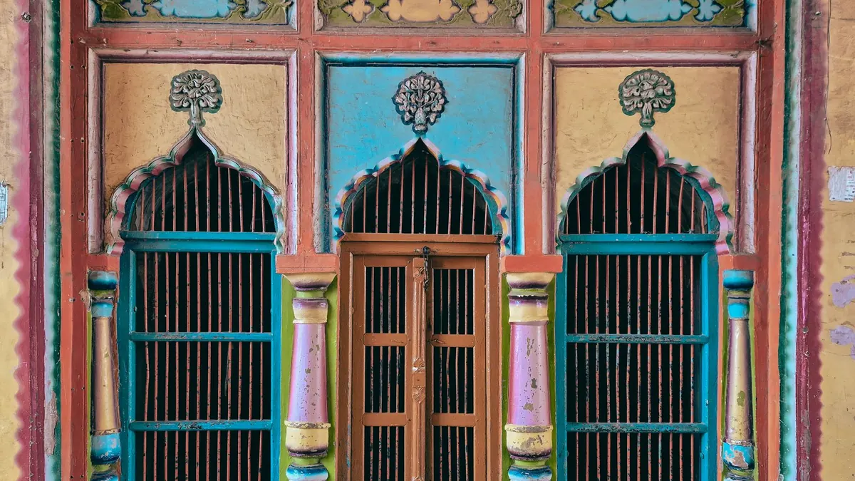 Colorful traditional windows with intricate designs in Ayodhya, Uttar Pradesh, India.