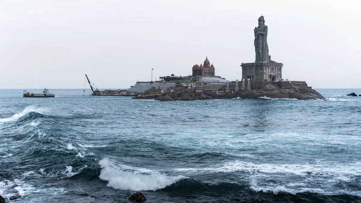 View of Vivekananda Rock Memorial and Thiruvalluvar Statue on a rocky islet in Kanyakumari.