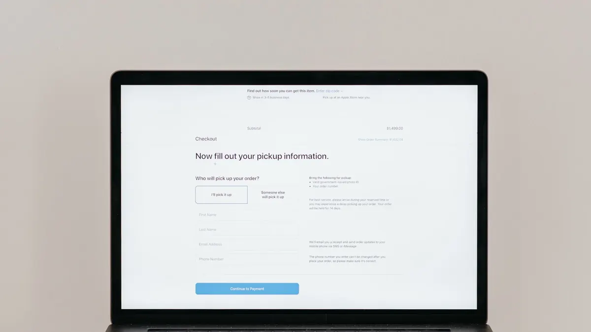 A laptop displaying an online checkout form, highlighting technology and e-commerce.