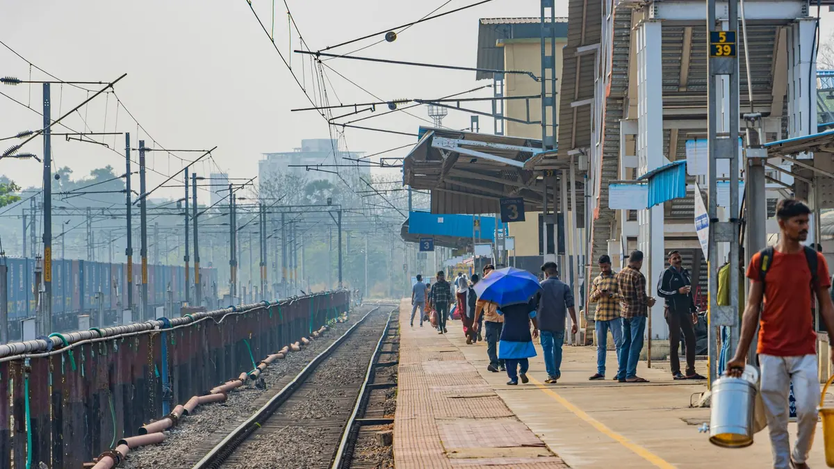 Passengers and trains at Mangaluru station, Karnataka, India.