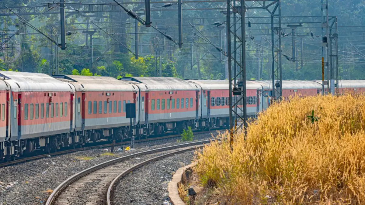 A long-distance express train curving through green countryside